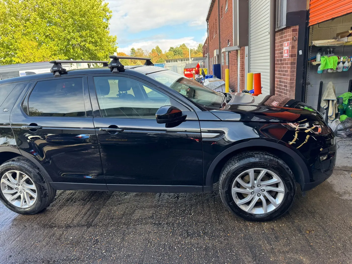 After: The same black Land Rover with the rear door scratches repaired