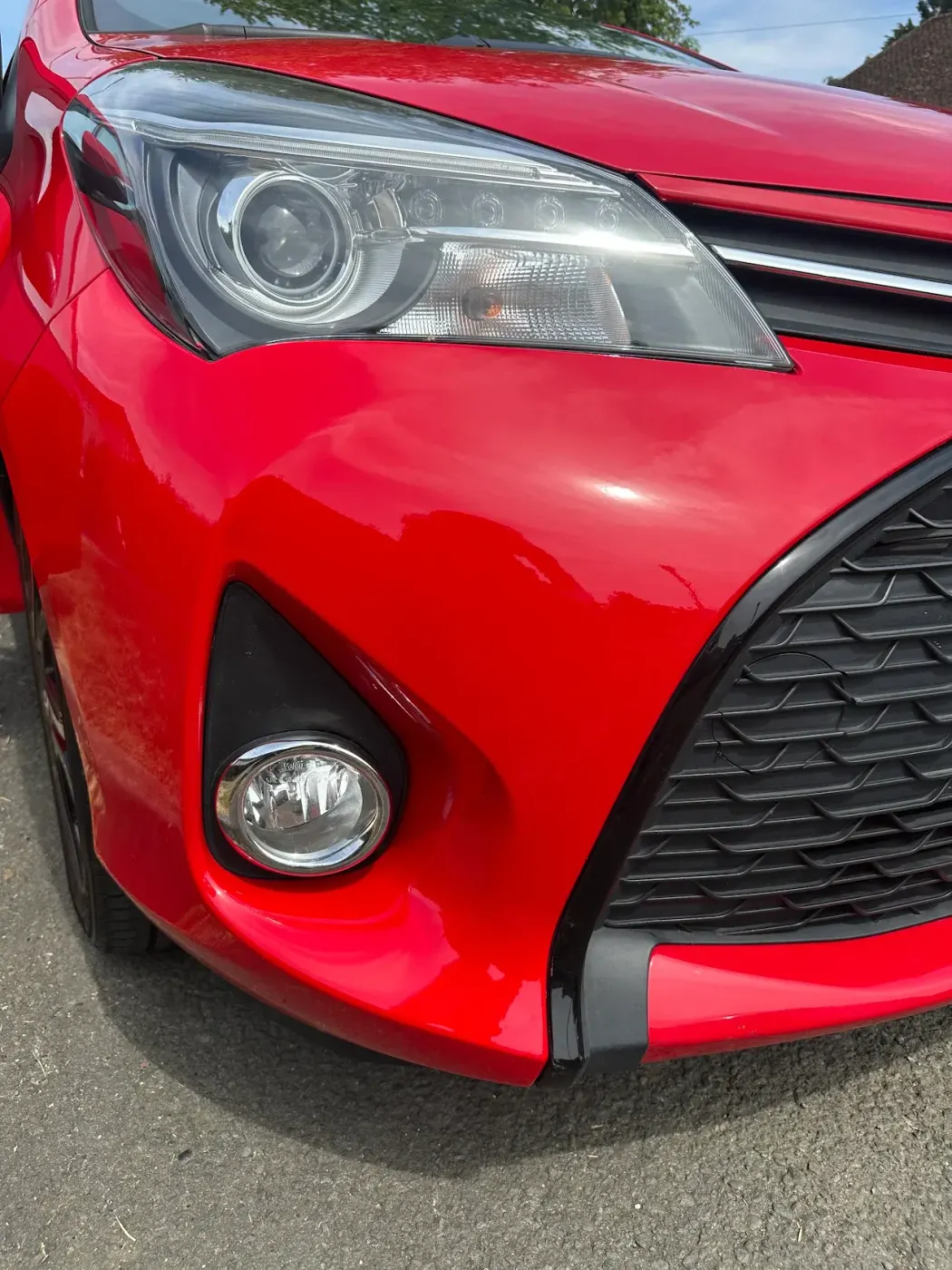 After: The same Toyota Yaris with the front bumper repaired and refinished
